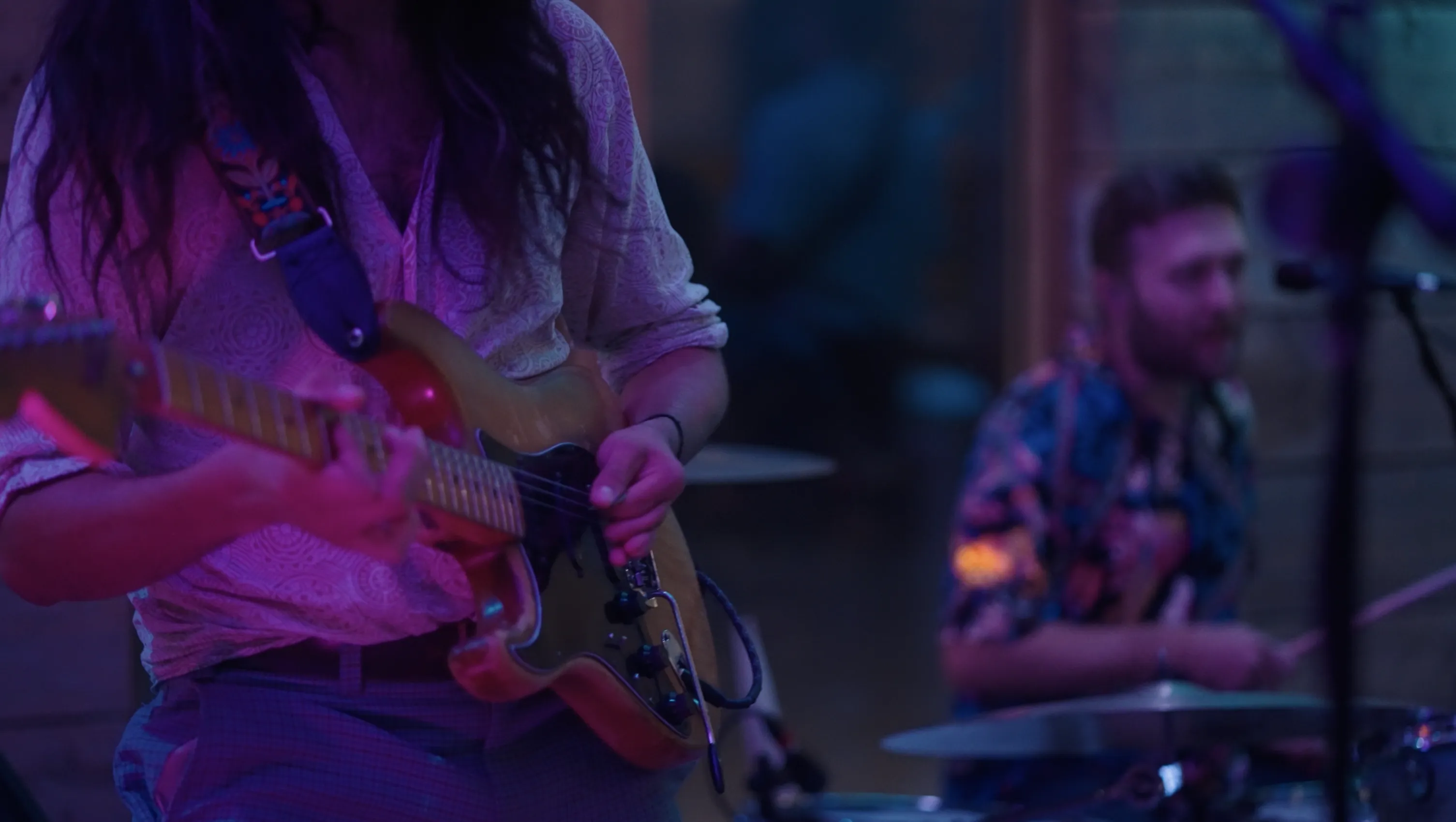 Lucas performing with guitar at a wedding event