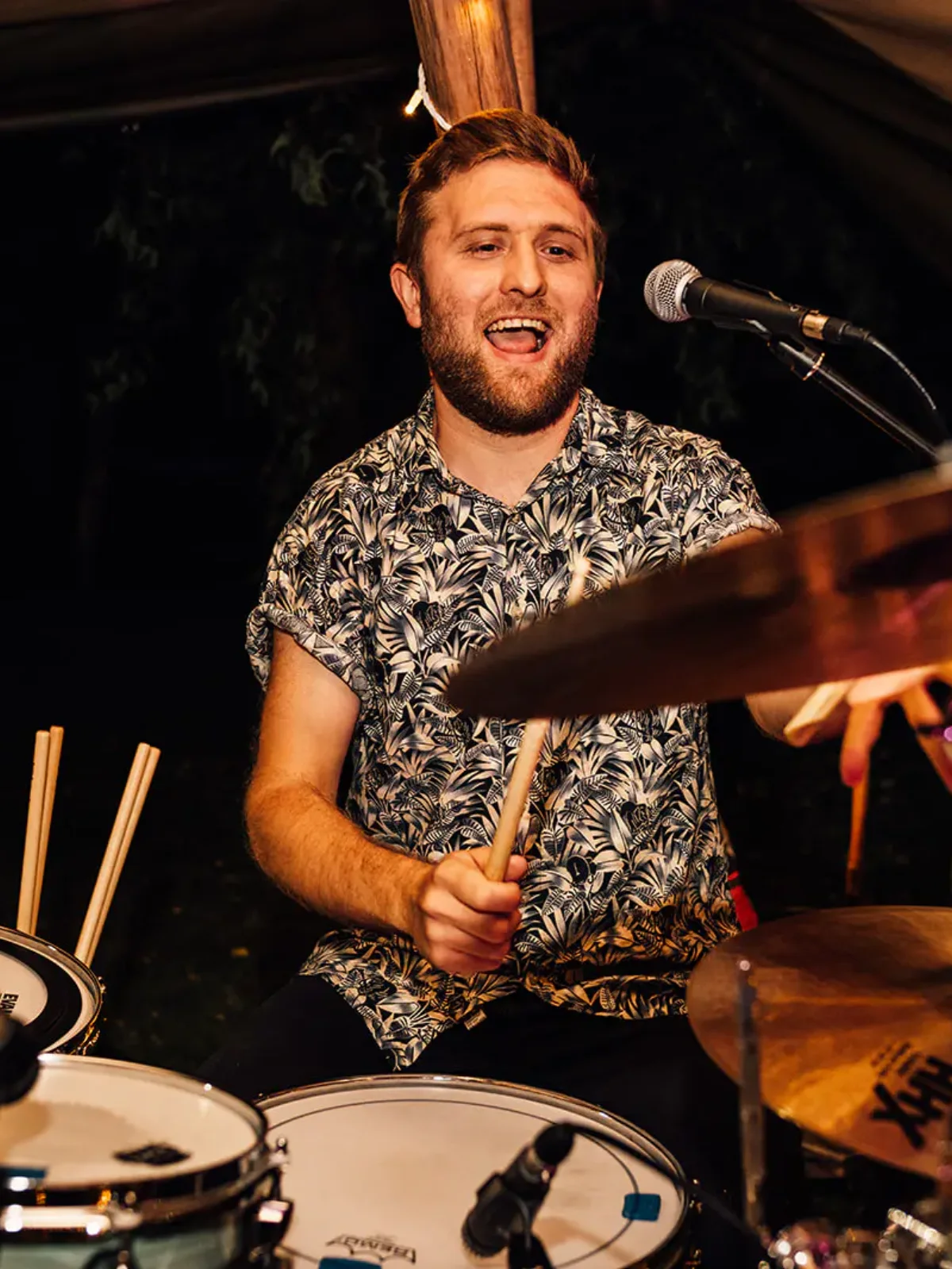 Kinmara's drummer singing mid set, with close microphones on the kit